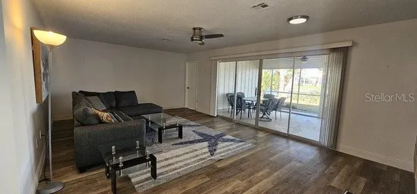 a living room with furniture and a table