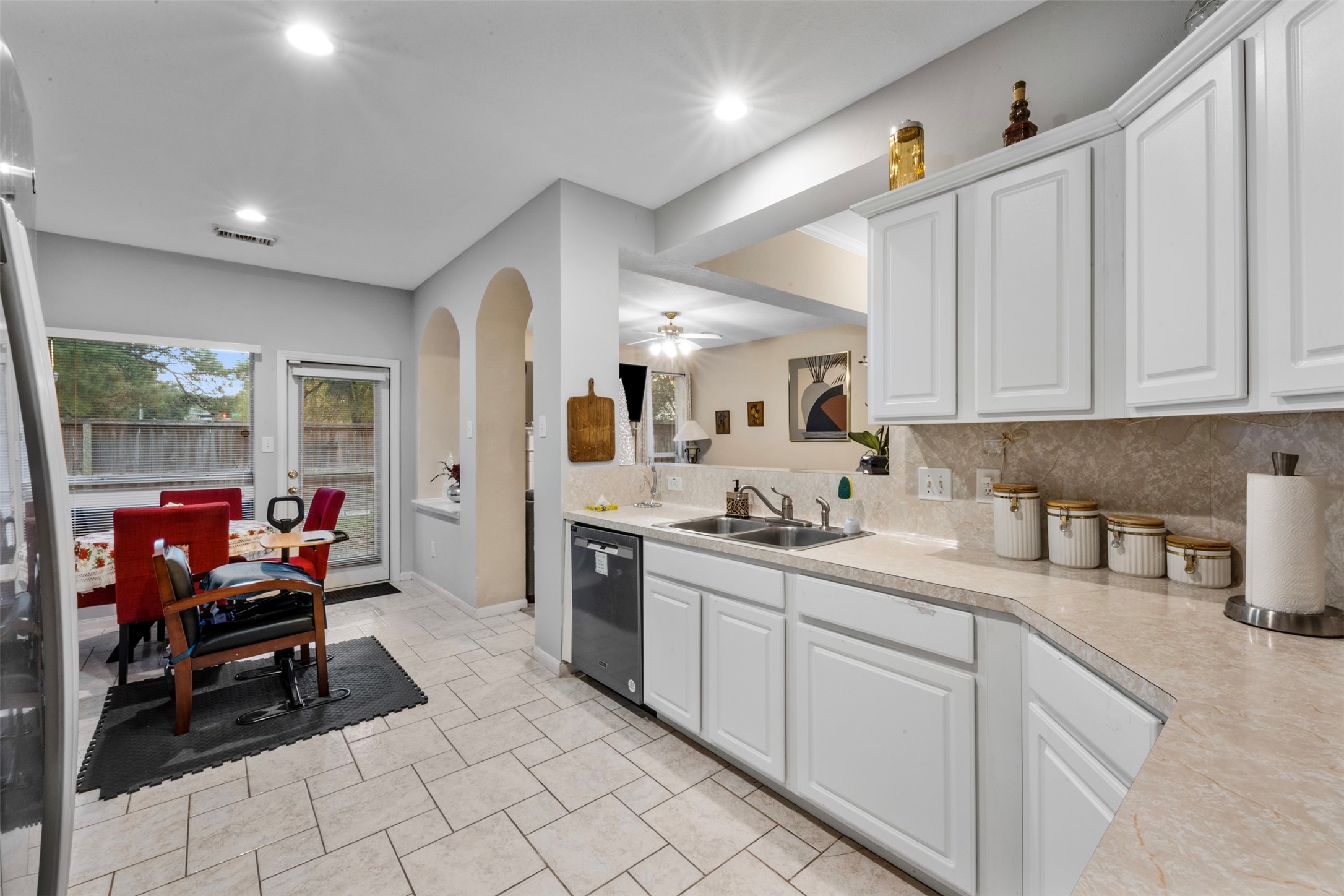 2334 Everest Way Houston, TX 77339 - Photo 13 of 29 a kitchen with stainless steel appliances kitchen island granite countertop a sink and cabinets