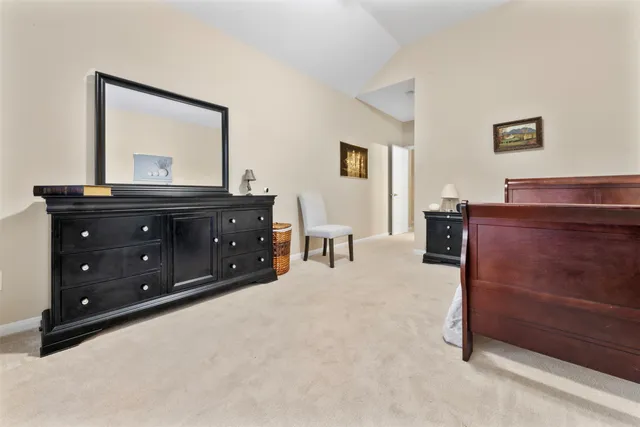 a room with a bed and a mirror