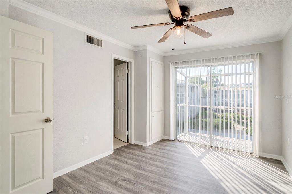 129 Blue Pointe Way, Unit 340 Altamonte Springs, FL 32701 - Photo 15 of 25 a view of a livingroom with a ceiling fan and window