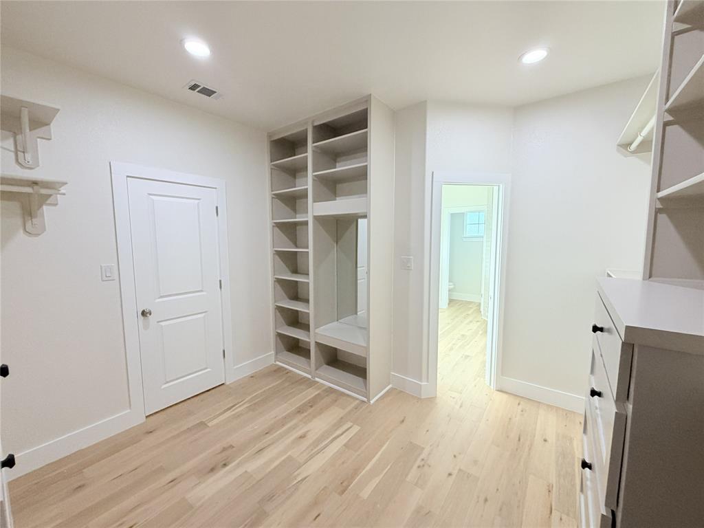 2780 Patrick Road Waxahachie, TX 75167 - Photo 14 of 20 a view of empty room with wooden floor and cabinet