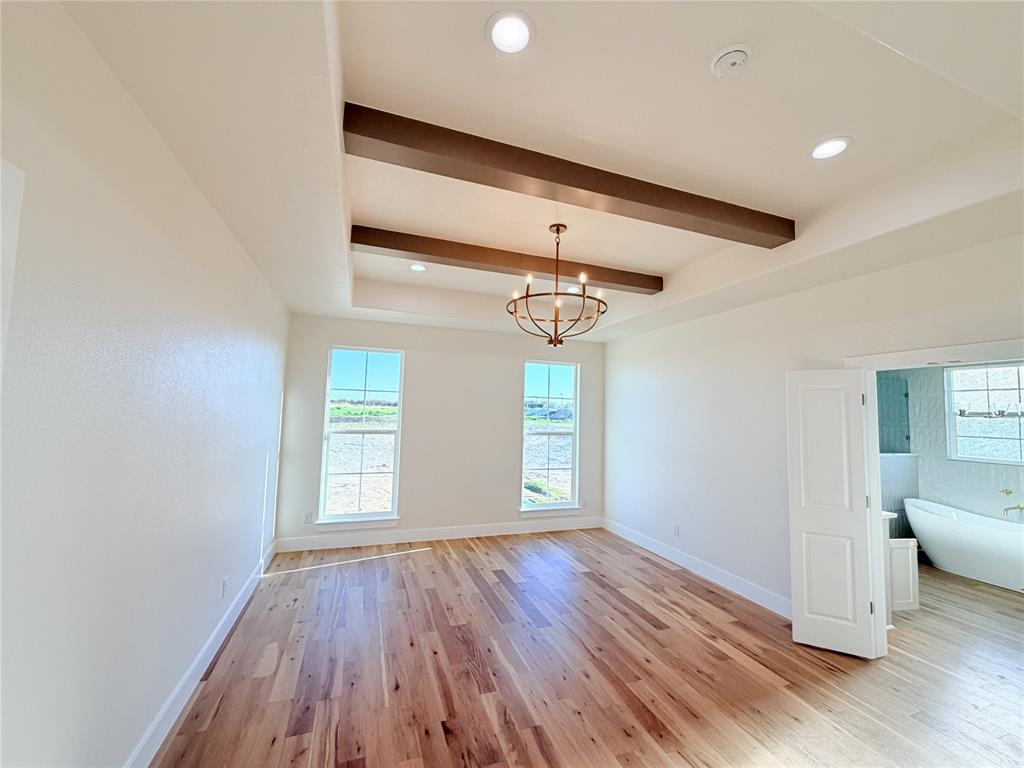 2780 Patrick Road Waxahachie, TX 75167 - Photo 16 of 20 a view of empty room with wooden floor and fan