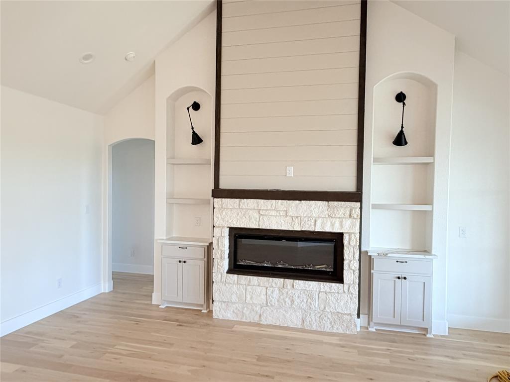 2780 Patrick Road Waxahachie, TX 75167 - Photo 18 of 20 a living room with a fireplace and wooden floor