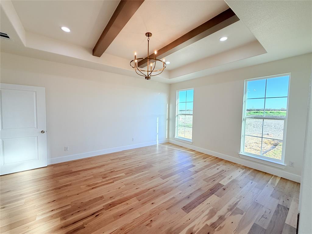 2780 Patrick Road Waxahachie, TX 75167 - Photo 4 of 20 wooden floor in an empty room with a window