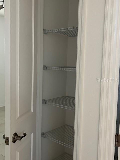 10584 Southwest 91st Street Road Ocala, FL 34481 - Photo 17 of 20 a bathroom with a glass shower door