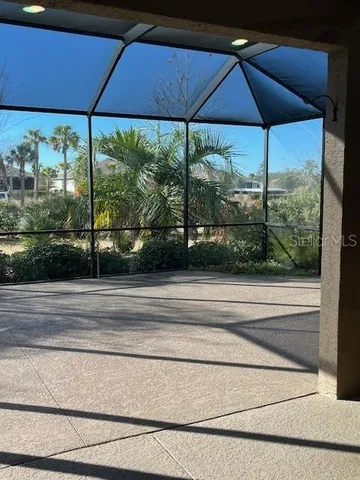 a view of a floor to ceiling window and an umbrella