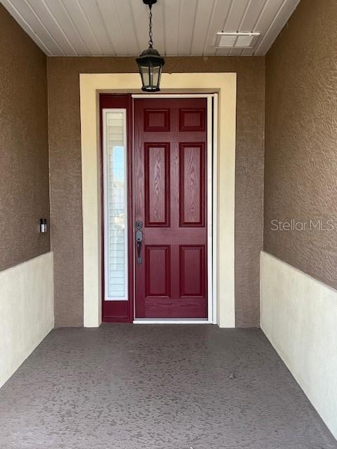 10584 Southwest 91st Street Road Ocala, FL 34481 - Photo 2 of 20 a view of a hallway with a chandelier
