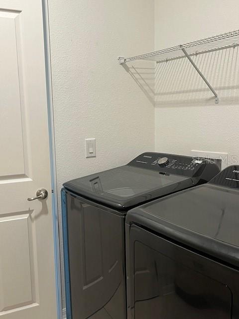 10584 Southwest 91st Street Road Ocala, FL 34481 - Photo 9 of 20 a utility room with dryer and washer