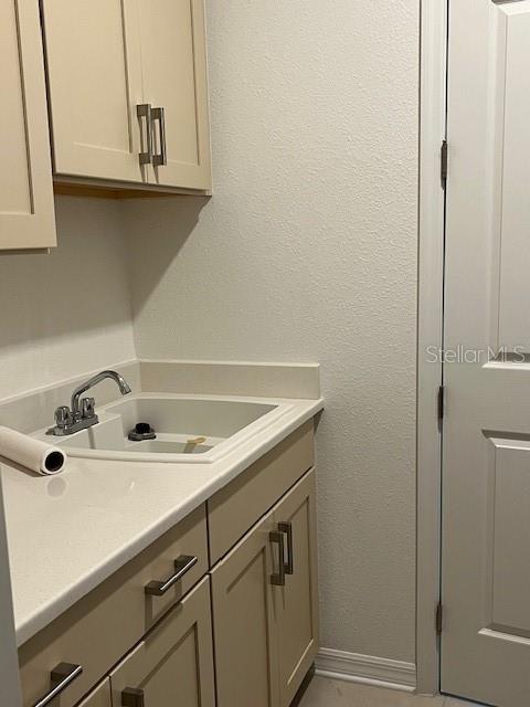 10584 Southwest 91st Street Road Ocala, FL 34481 - Photo 10 of 20 a bathroom with a sink and cabinets