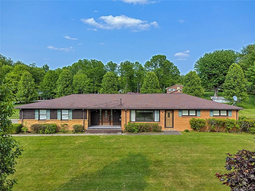 1702 Ridge Road Jeannette, PA 15644 - Photo 1 of 36 a view of a house with a yard