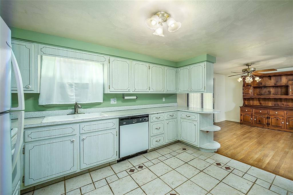 1702 Ridge Road Jeannette, PA 15644 - Photo 16 of 36 a kitchen with a sink and cabinets