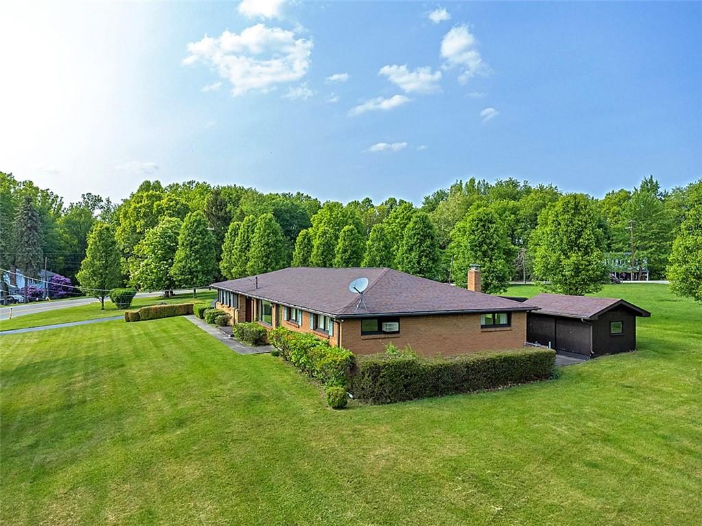 1702 Ridge Road Jeannette, PA 15644 - Photo 34 of 36 a view of a house with a yard