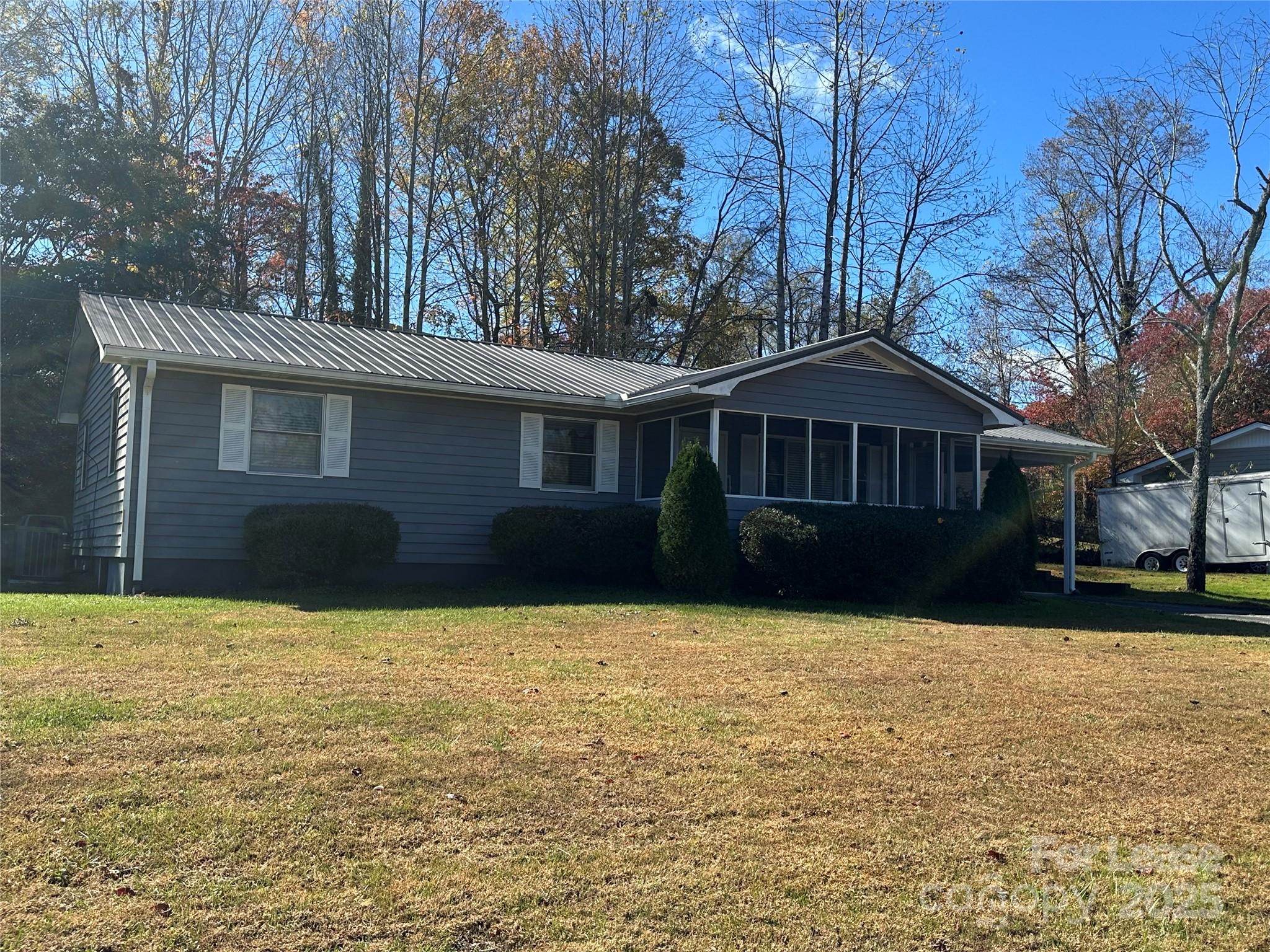 Undisclosed Address Hendersonville, NC 28792 - Photo 1 of 19 a front view of a house with yard