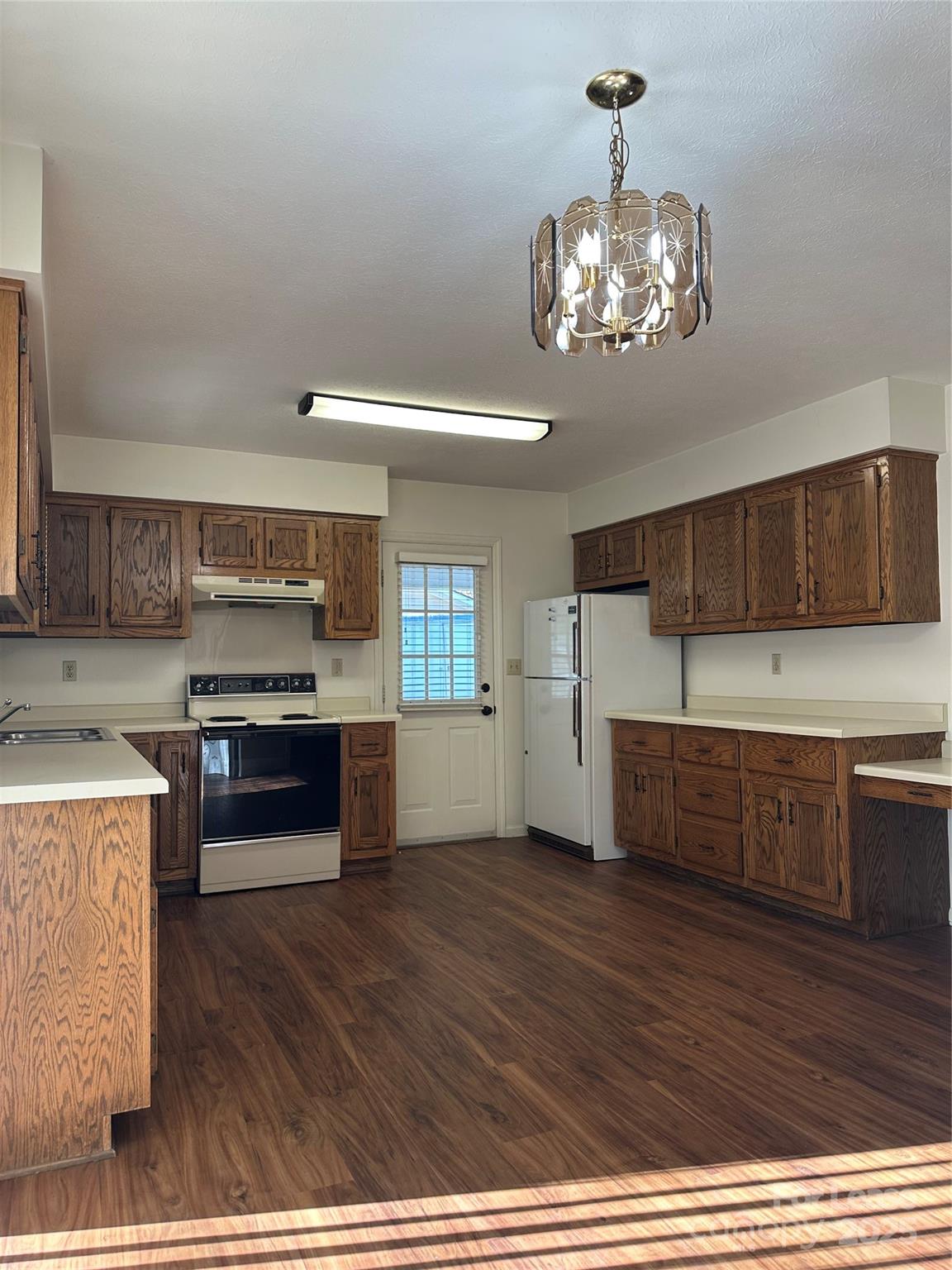 Undisclosed Address Hendersonville, NC 28792 - Photo 3 of 19 a kitchen with stainless steel appliances granite countertop a stove and cabinets