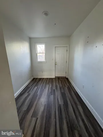 a view of a house with stairs and wooden stairs