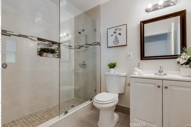 a bathroom with a toilet sink and shower