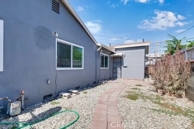 a bedroom with bed and a window