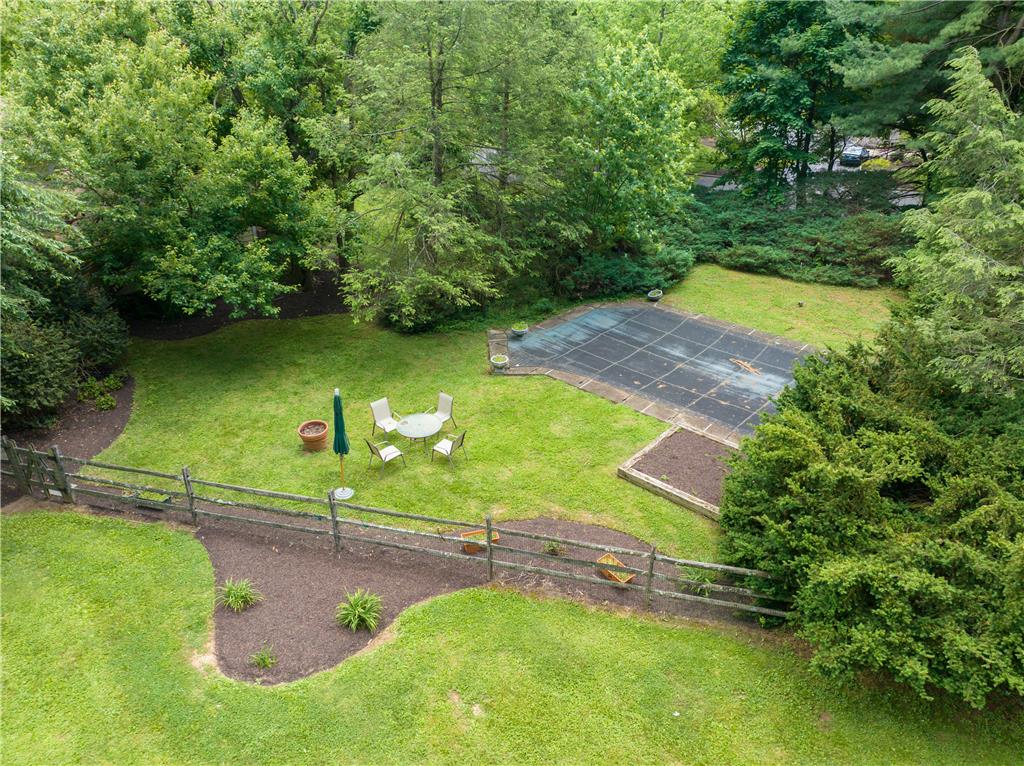 2516 Rachael Lane Orefield, PA 18069 - Photo 40 of 45 A private outdoor space features a shimmering pool, verdant lawn, and mature trees.