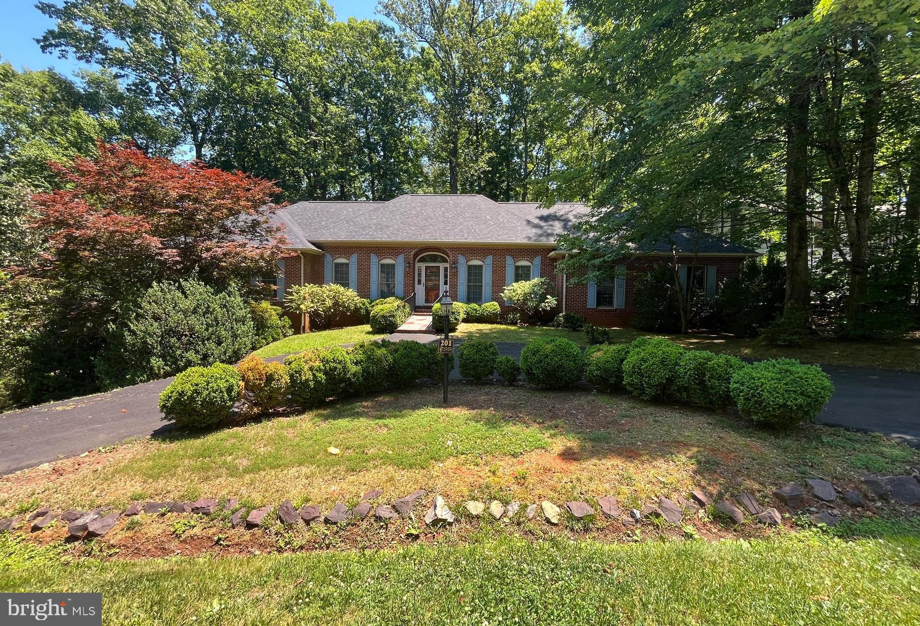 Beautiful landscaped lot with a circular driveway