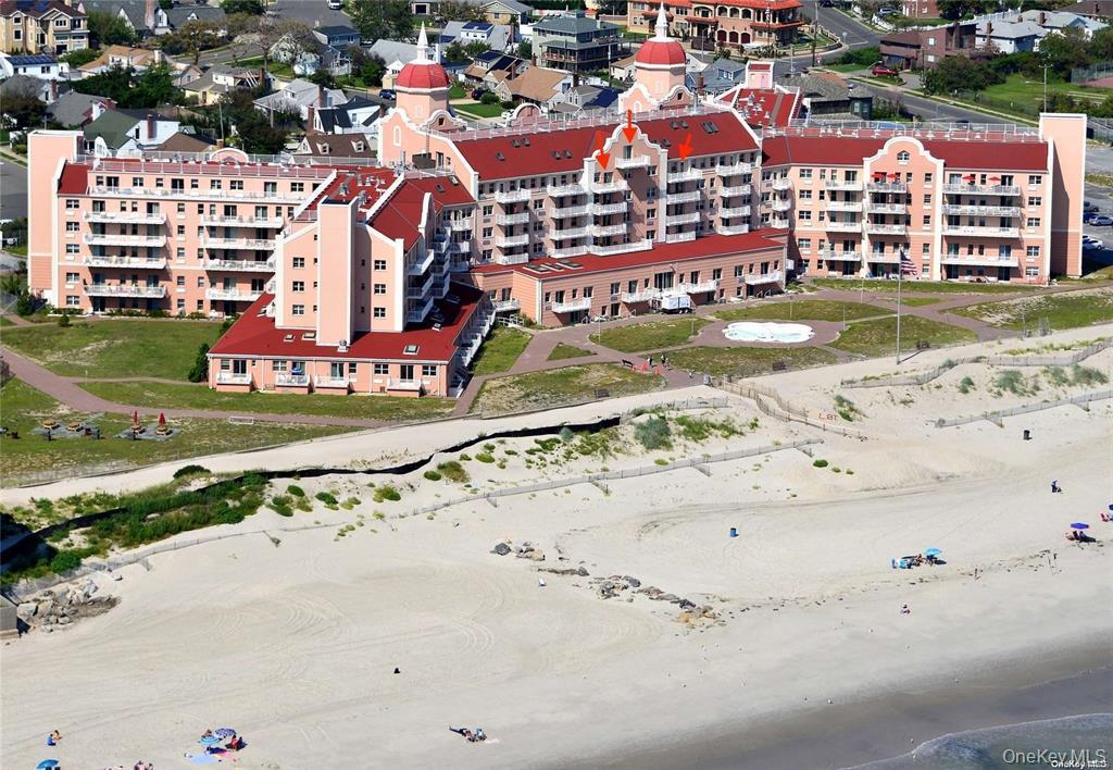 an aerial view of residential houses and outdoor space