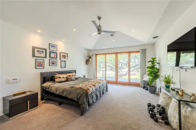 a bedroom with a bed and a couch