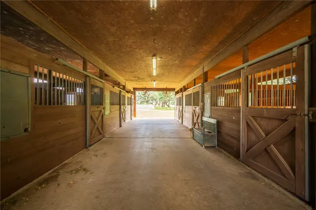 a view of a house with a yard and a garage