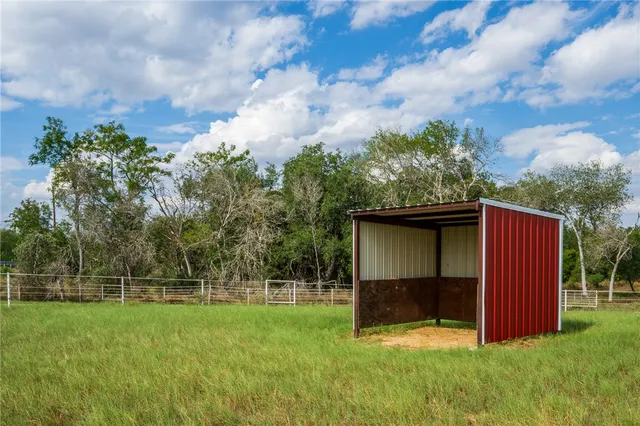 a view of a swimming pool with an outdoor space and seating area
