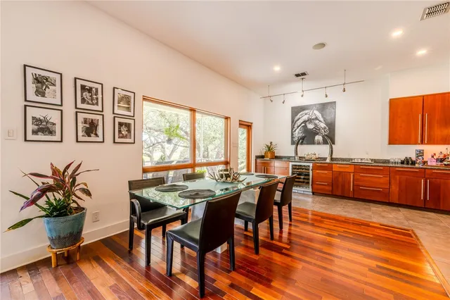 a view of a dining room with furniture window and wooden floor
