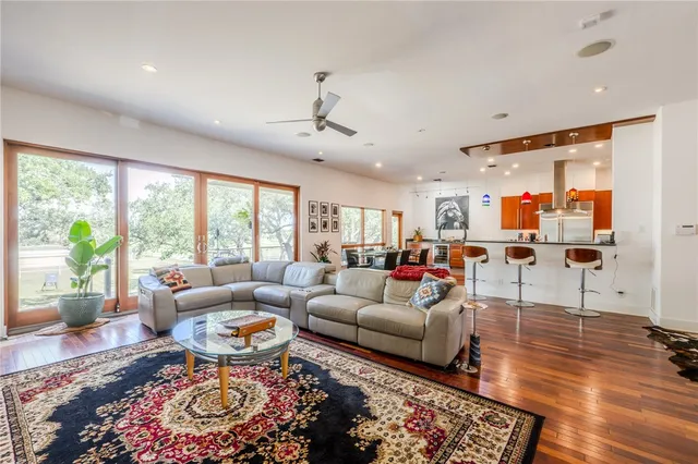 a living room with furniture and a large window