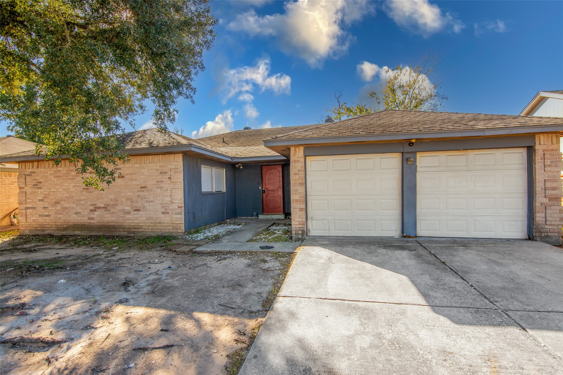 20031 Woodhall Lane Humble, TX 77338 - Photo 2 of 16 a view of a house with a yard and garage
