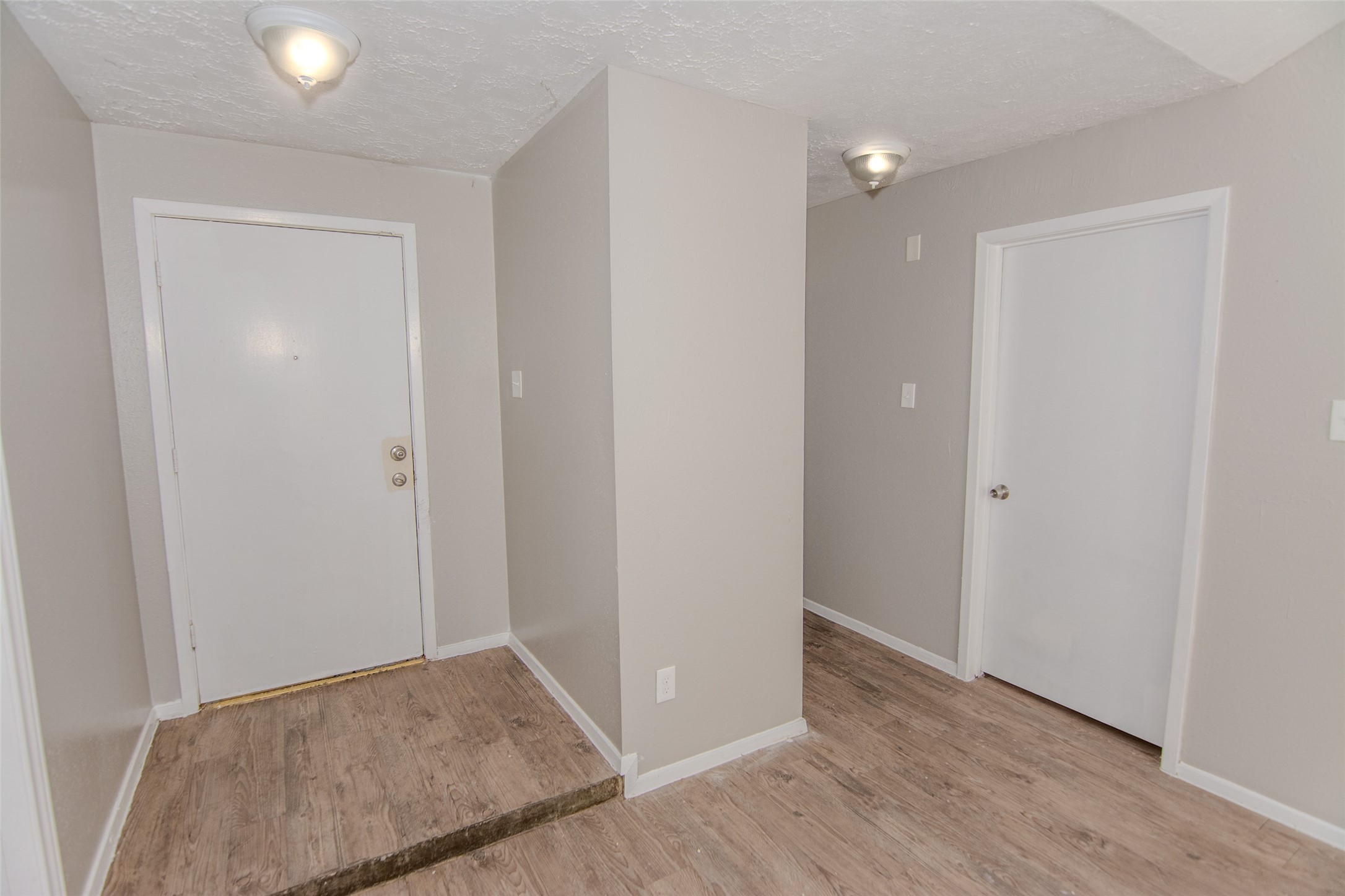 20031 Woodhall Lane Humble, TX 77338 - Photo 3 of 16 a view of hallway with wooden floor