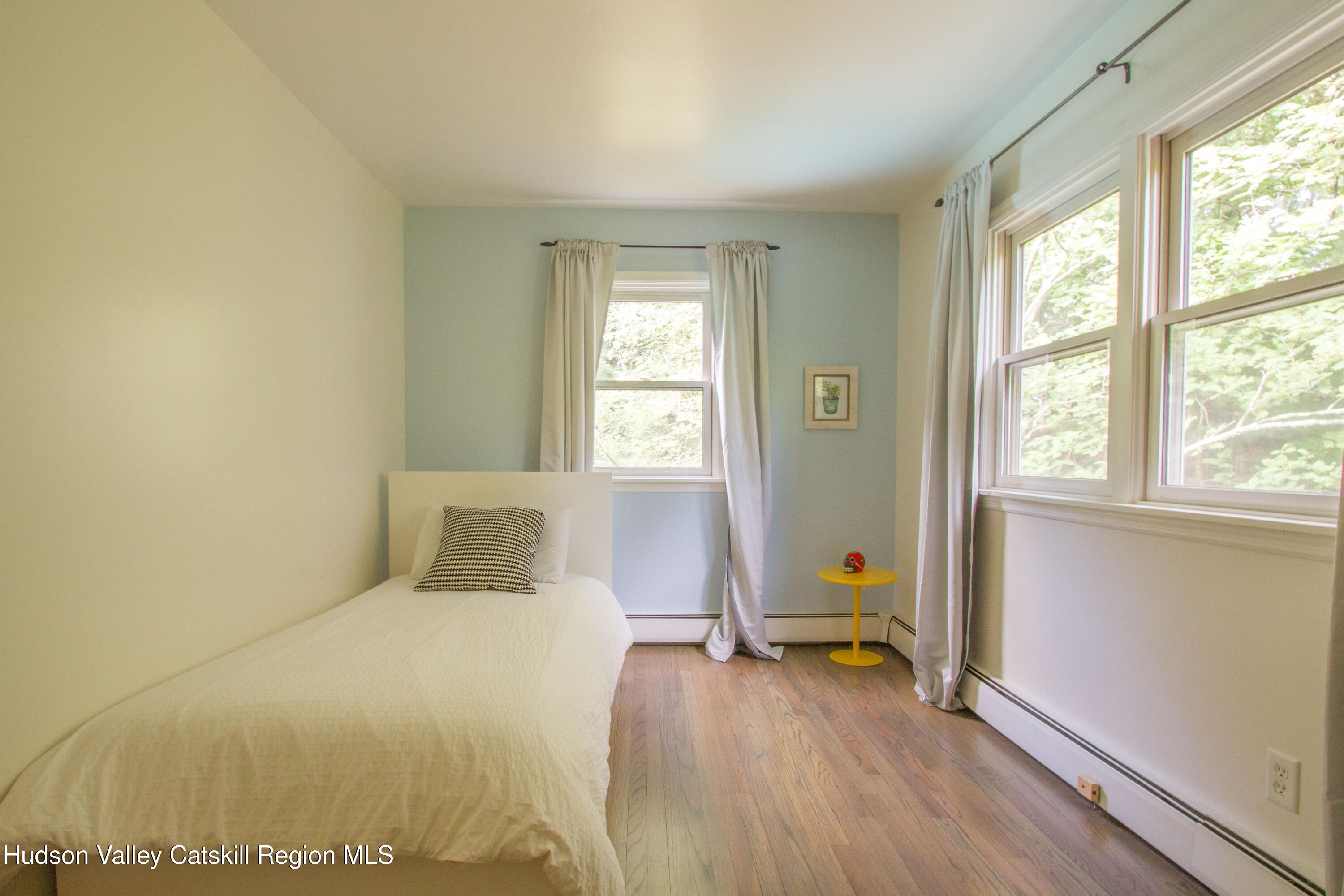 11 Shultis Farm Road Woodstock, NY 12409 - Photo 16 of 23 a bedroom with a bed and wooden floor
