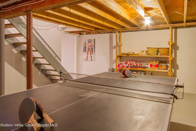 a living room with a couch and a table with wooden floor