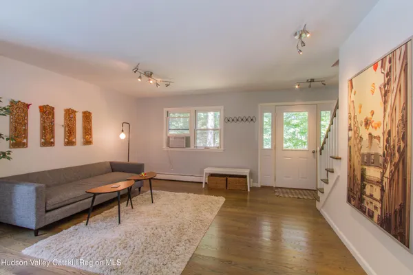 a living room with furniture and a window