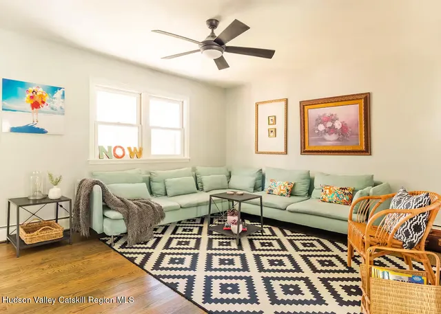 a living room with furniture and a rug