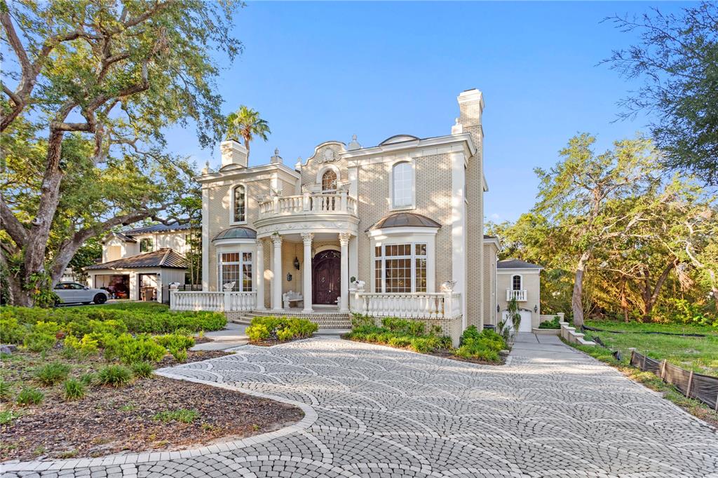 1577 Alexander Road Belleair, FL 33756 - Photo 2 of 65 a front view of building with yard