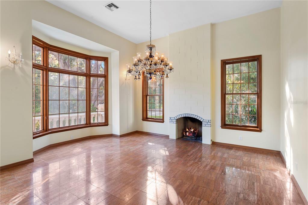 1577 Alexander Road Belleair, FL 33756 - Photo 27 of 65 a view of an empty room with window and fire place