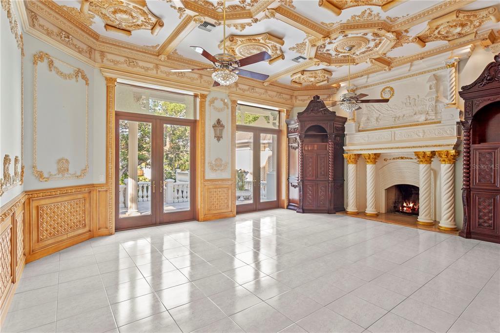 1577 Alexander Road Belleair, FL 33756 - Photo 33 of 65 a view of an empty room with a fireplace and a window