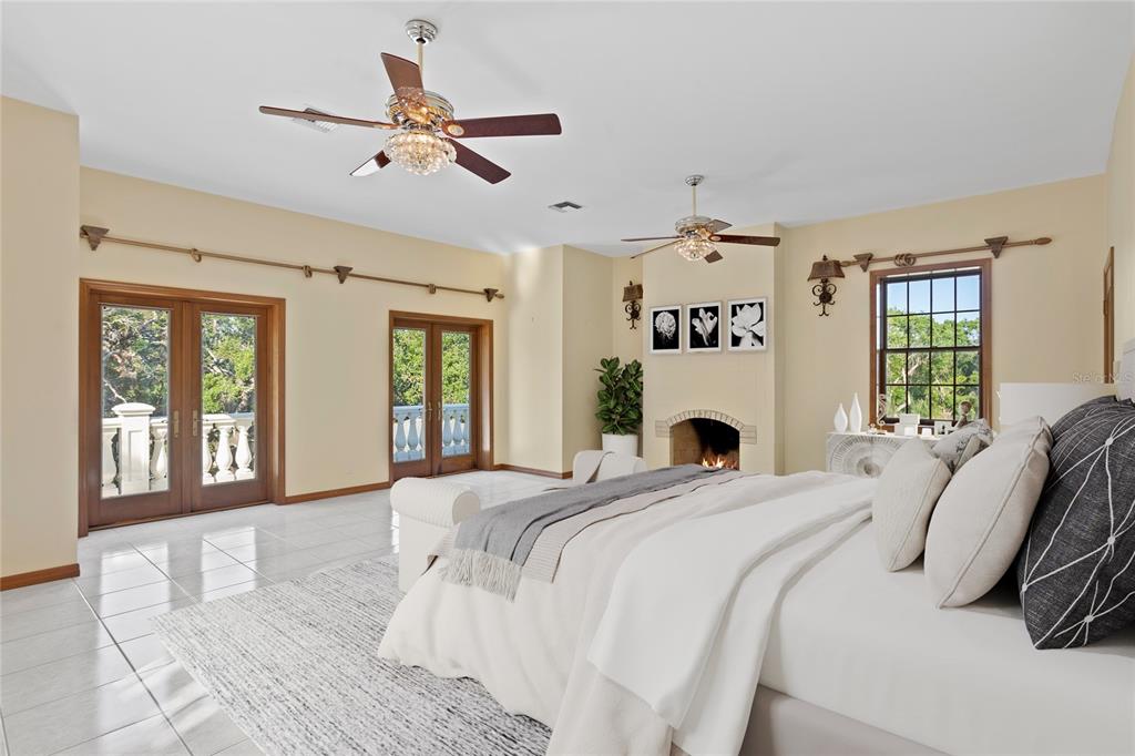 1577 Alexander Road Belleair, FL 33756 - Photo 34 of 65 a bed sitting in a bedroom and a large window