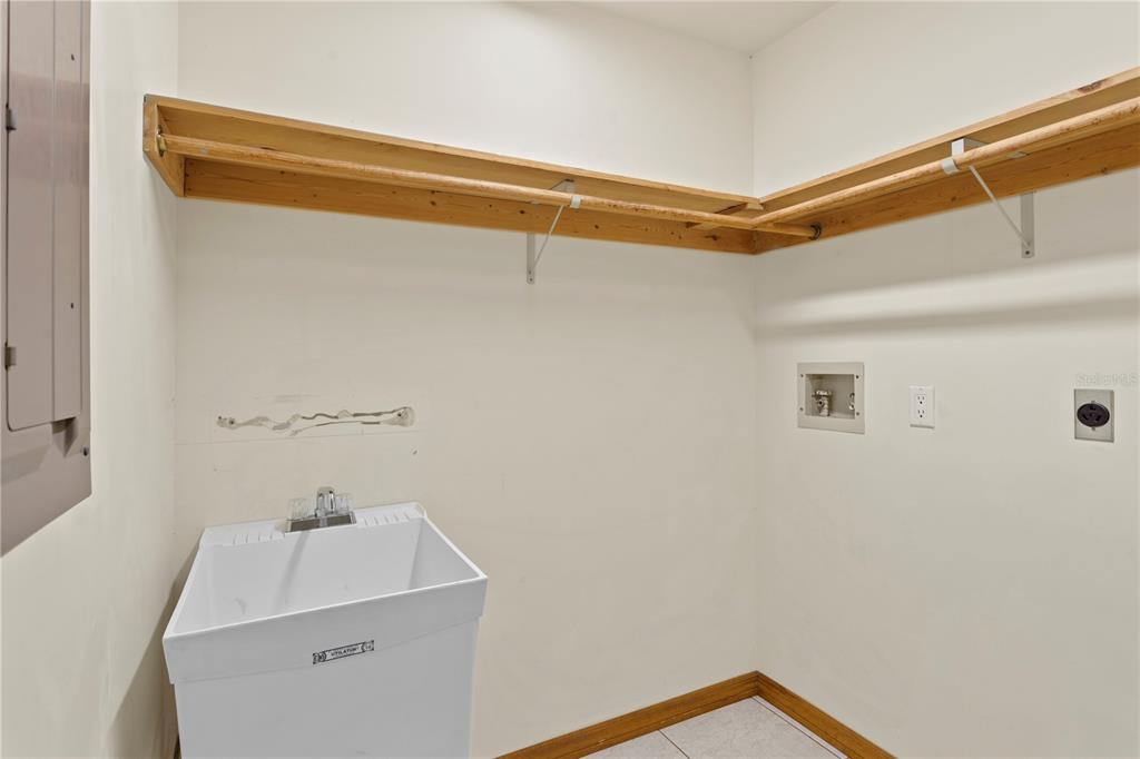 1577 Alexander Road Belleair, FL 33756 - Photo 51 of 65 a bathroom with a sink and vanity