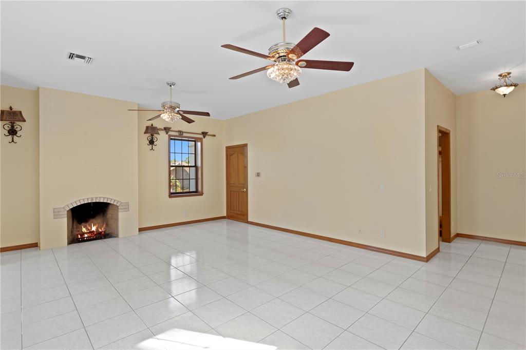 1577 Alexander Road Belleair, FL 33756 - Photo 54 of 65 a view of livingroom with hardwood floor and a ceiling fan