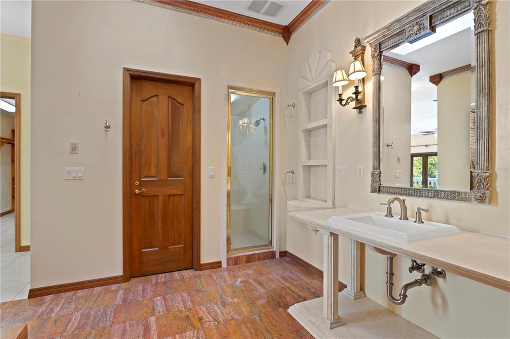 1577 Alexander Road Belleair, FL 33756 - Photo 60 of 65 a bathroom with a sink and a mirror