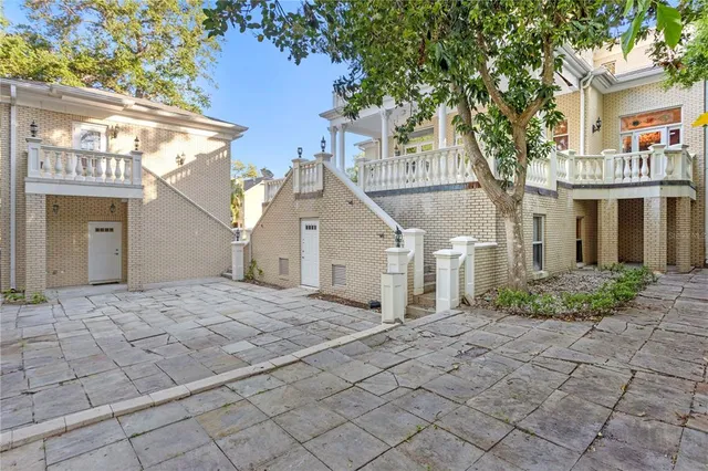 a view of a fireplace with entryway and a fireplace