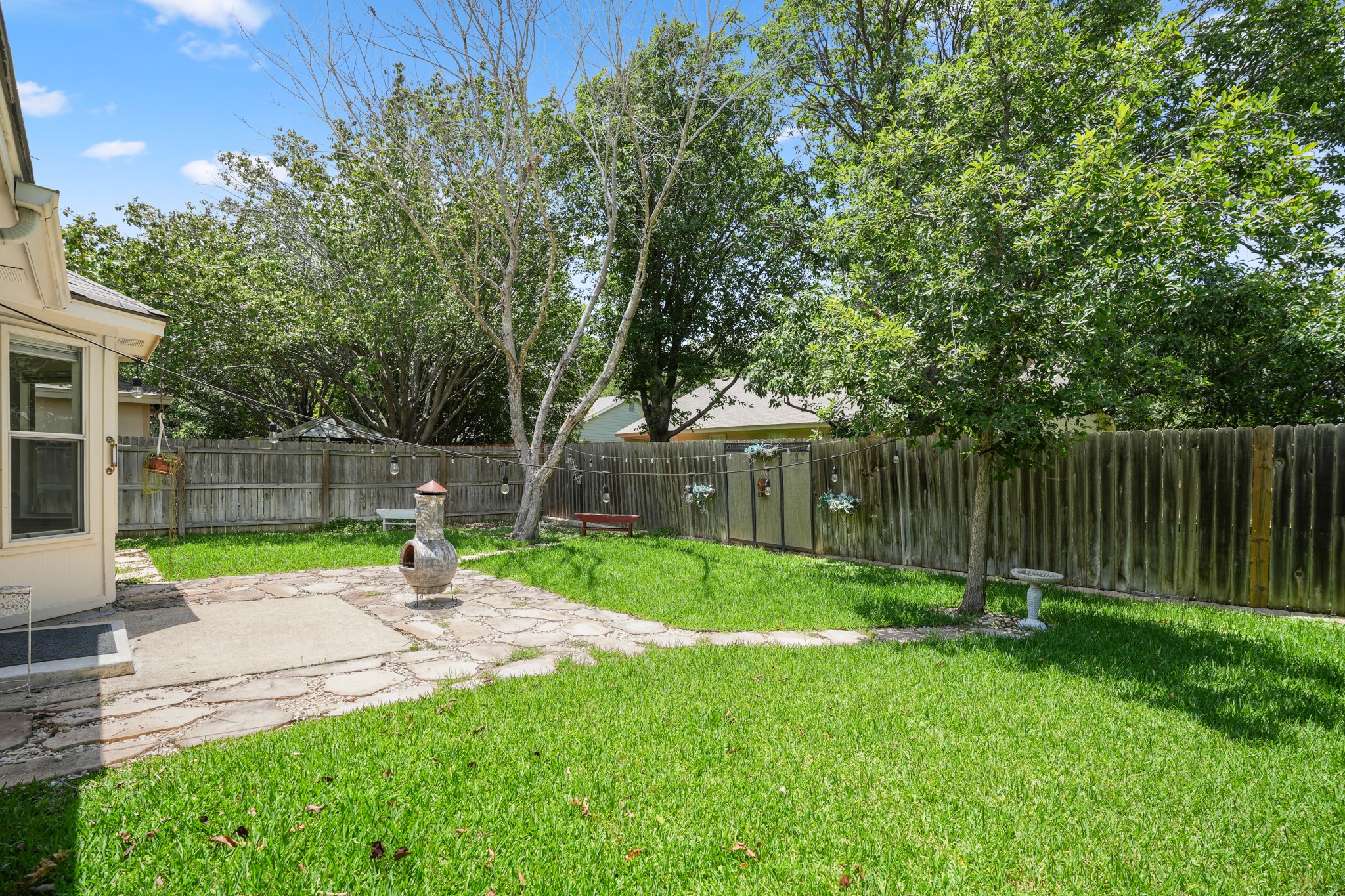 438 Katy Crossing Georgetown, TX 78626 - Photo 23 of 24 A flagstone patio provides a pleasant outdoor setting in this private backyard oasis.