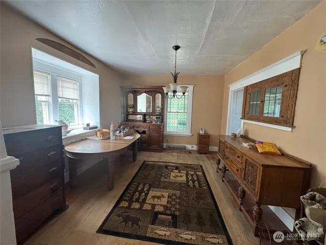a living room with furniture a ceiling fan and a window