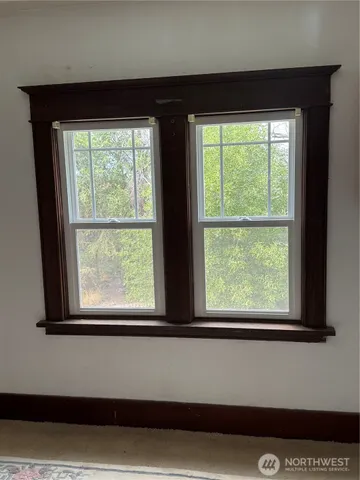 a view of empty room with windows