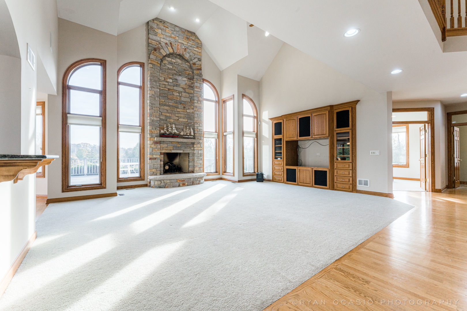 23374 West Milton Road Wauconda, IL 60084 - Photo 11 of 49 a view of an empty room with a fireplace and a window
