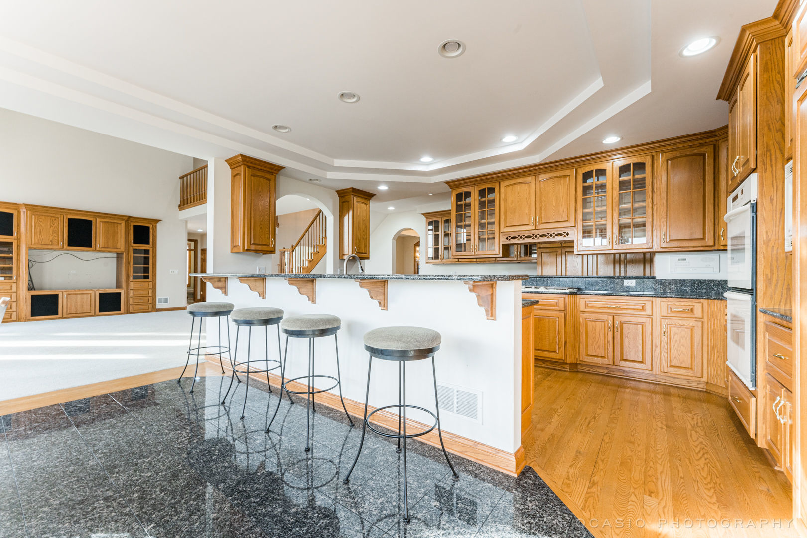23374 West Milton Road Wauconda, IL 60084 - Photo 18 of 49 a living room with stainless steel appliances granite countertop furniture and a wooden floor