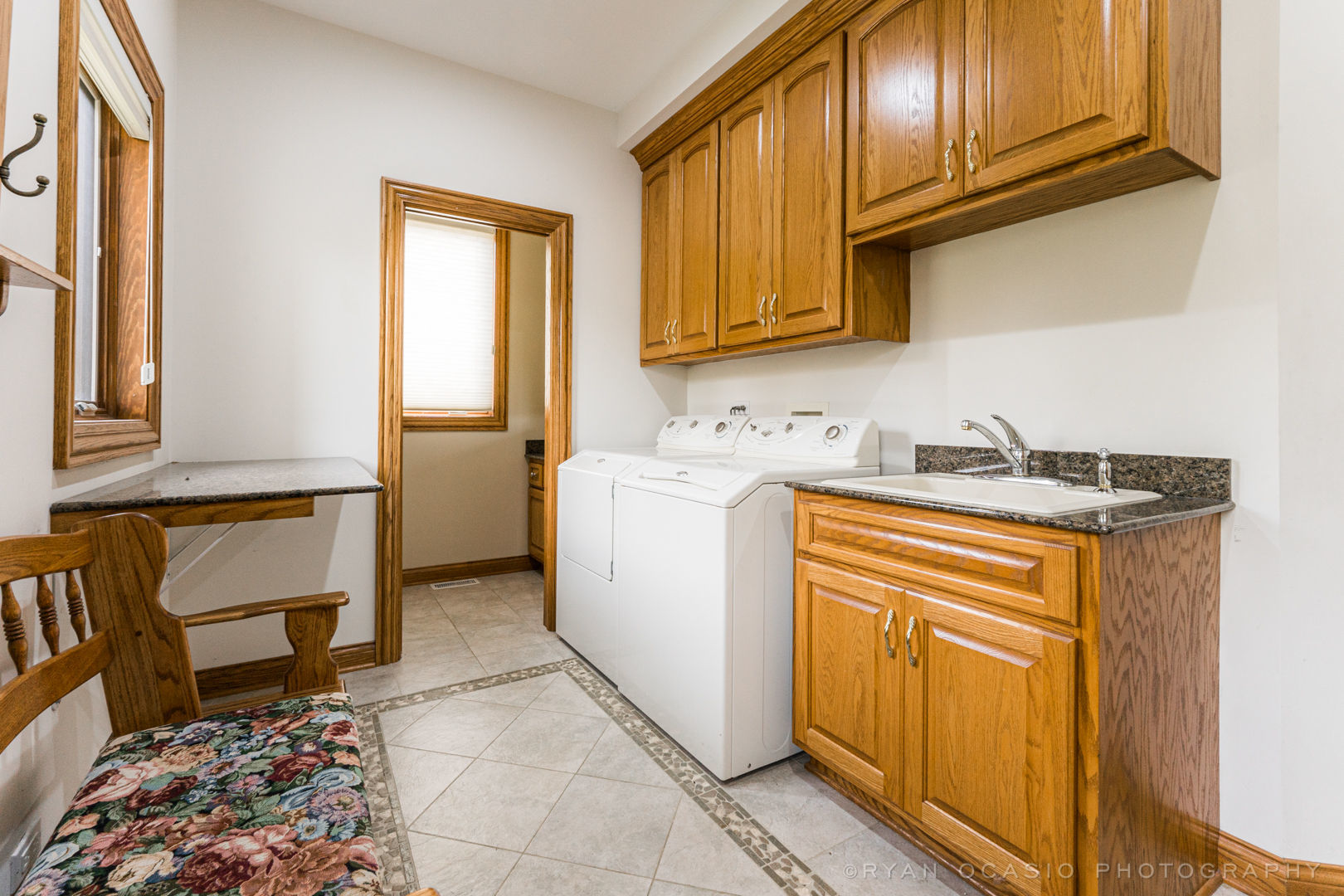 23374 West Milton Road Wauconda, IL 60084 - Photo 24 of 49 a utility room with granite countertop cabinets washer and dryer