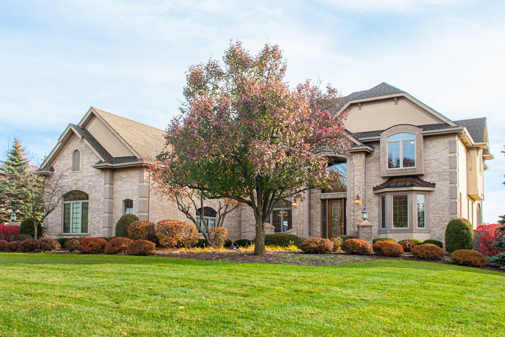 23374 West Milton Road Wauconda, IL 60084 - Photo 3 of 49 a view of a house with a big yard and large trees